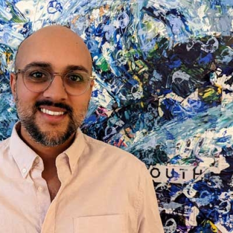 Headshot of graduate Arun Verma smiling to camera