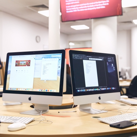 Close up of Macs in the CCI newsroom