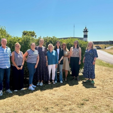 Group photo of PhD students stood by Southsea Castle