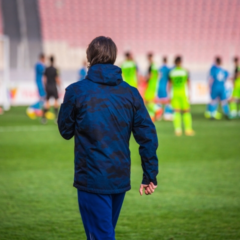 Football head trainer during professional soccer match
