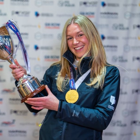 Emma Haxell holding the GB Row Challenge cup