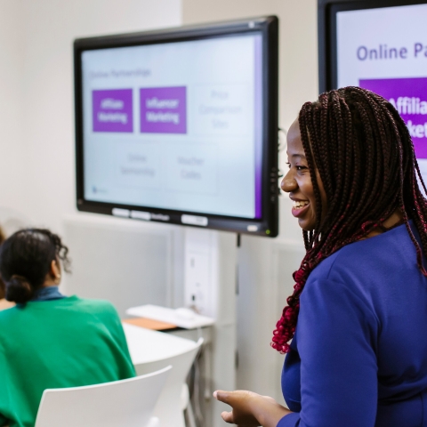 Tara Goddard speaking at a seminar
