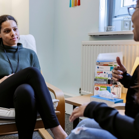 Two women talking in a therapy setting