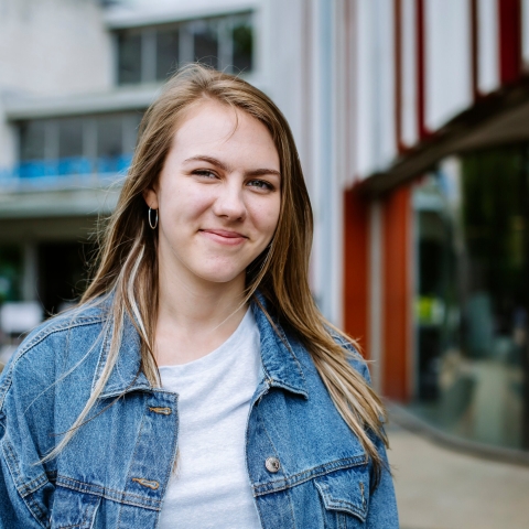 Smiling student outside of library