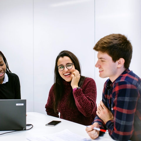 Group of postgraduate students in a meeting room