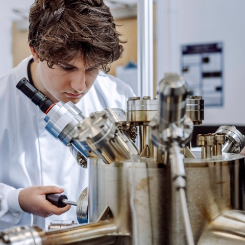Man looking at lab equipment