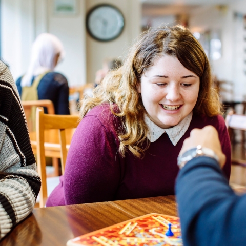 Students playing board games