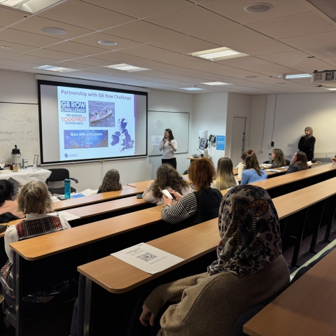 Students in a lecture theatre watching a presentation