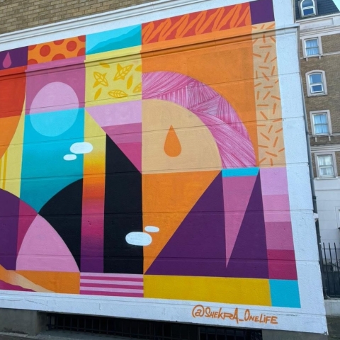 Colourful mural on the side of Rees Halls in Portsmouth for LOOKUP Festival