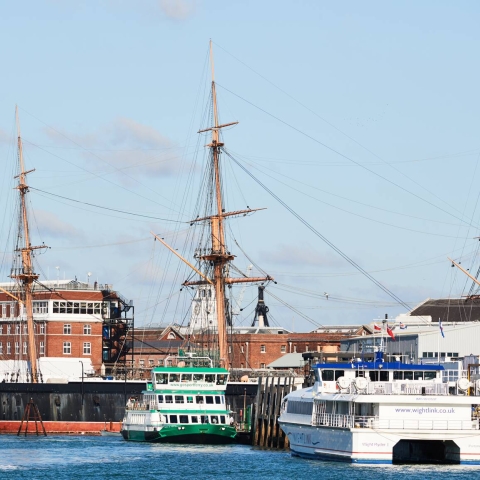 Portsmouth Harbour with historic dockyard ships and ferries