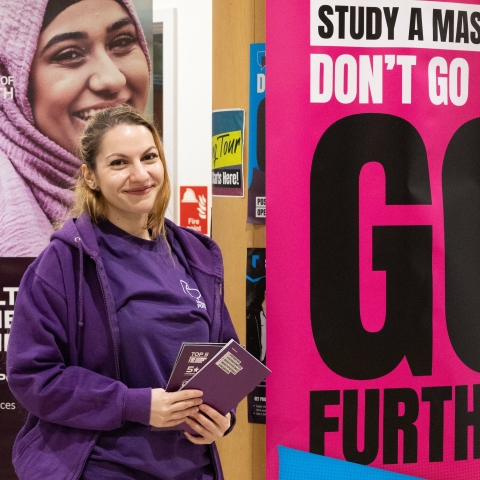 Staff promoting a stand at PG open days 