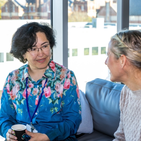 Two people sitting and talking