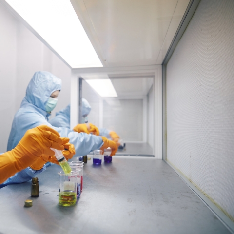 Pharmacology students experimenting with syringe in lab