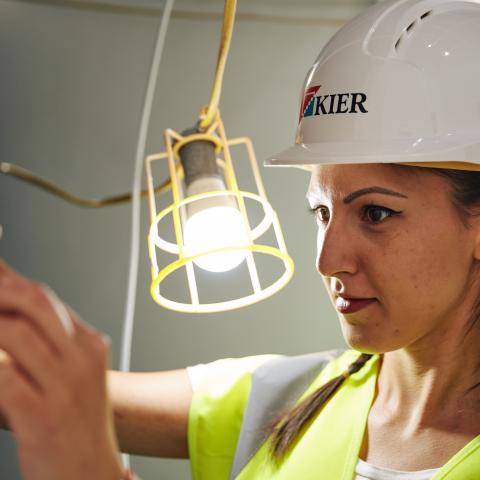 female civil engineering student at building site