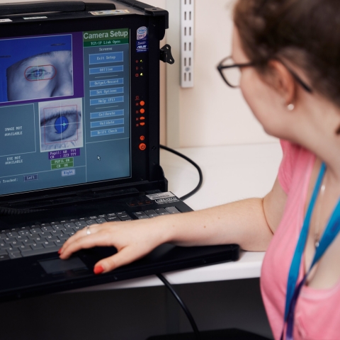 Psychology conducting eye exam