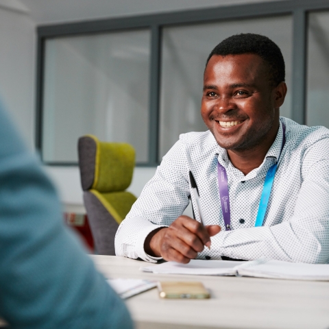 Smiling male staff member