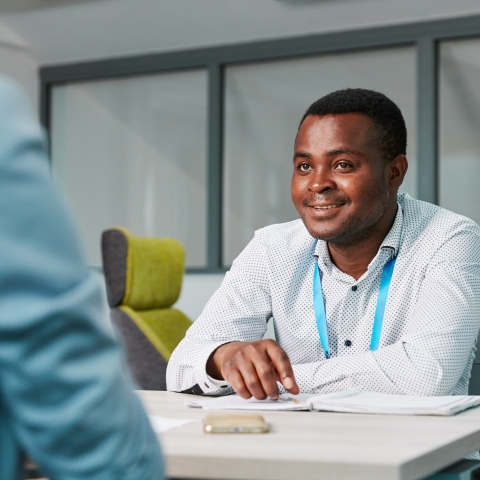 Two people sitting and talking