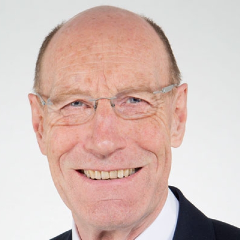 Sir John Armitt smiling to camera