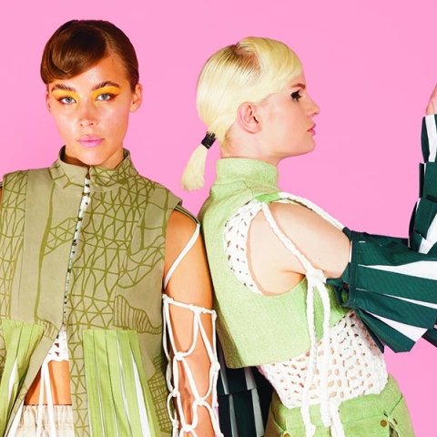 Two people wearing student fashion designs by Tassia Murray