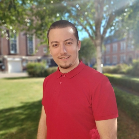 Global Recruitment officer Teddy looking at the camera