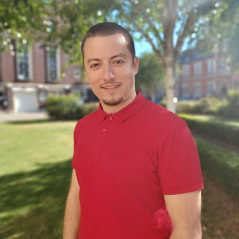 Global Recruitment officer Teddy looking at the camera