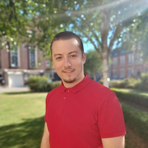 Global Recruitment officer Teddy looking at the camera