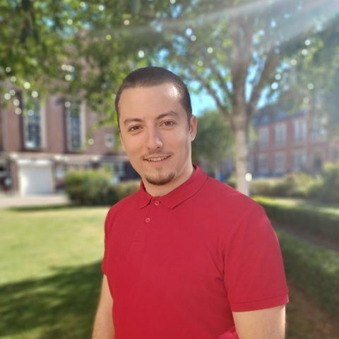 Global Recruitment officer Teddy looking at the camera