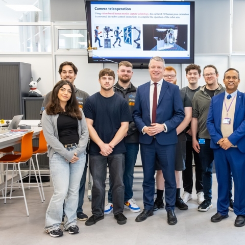 Students and staff with Defence Minister Luke Pollard MP in the University of Portsmouth’s Robotics and Automation Lab
