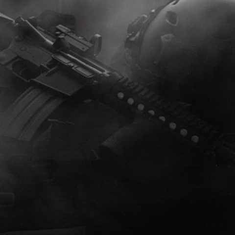 A large gun engulfed in dark smoke