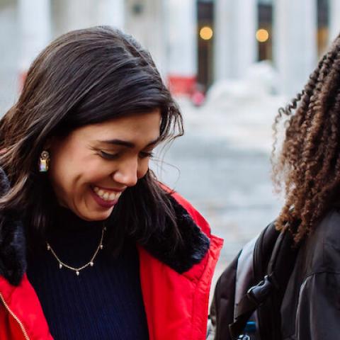 two students at guildhall smiling 