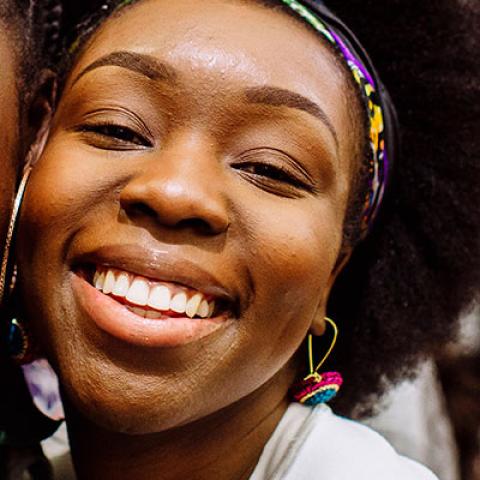 Smiling students posing for photo in Students' Union Third Space