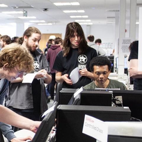 A game development team playing on PC