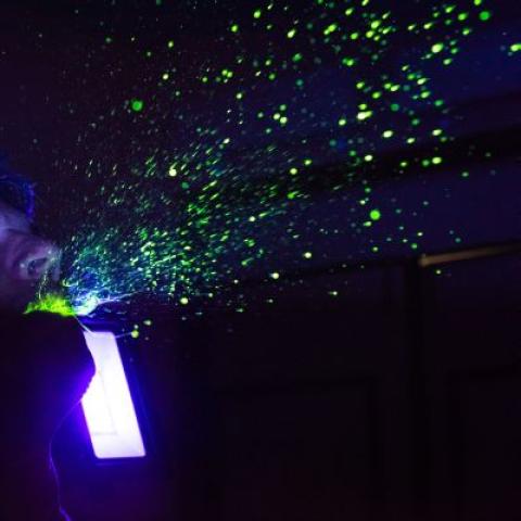 Man sneezing yellow dye