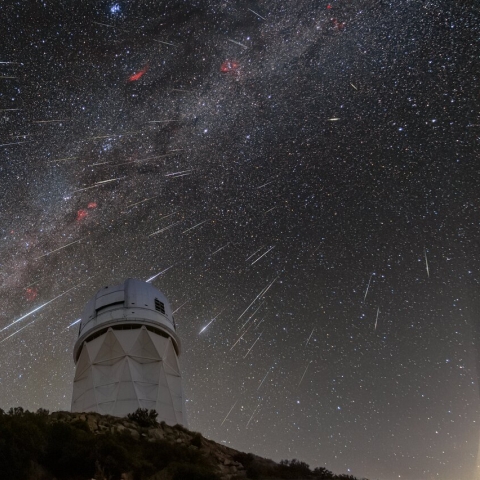 DESI observes the sky from the Mayall Telescope, shown here during the 2023 Geminid meteor shower