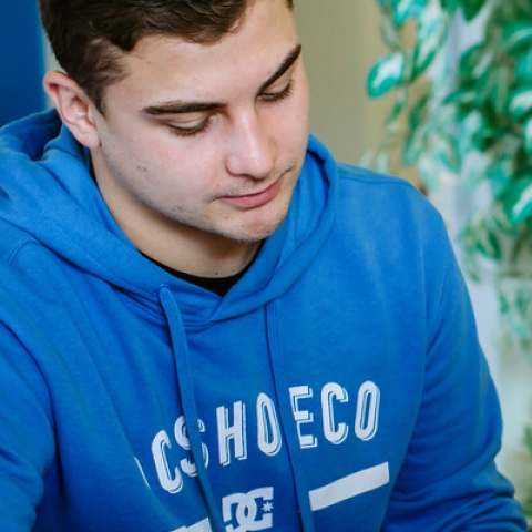 Male student getting advice from female advisor