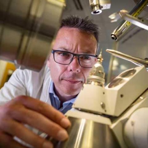 Professor John McGeehan working with lab equipment