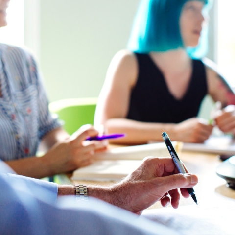 Staff signing papers