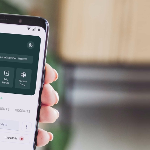 Picture of hand holding phone showing finance app - Photo by Thriday on Unsplash