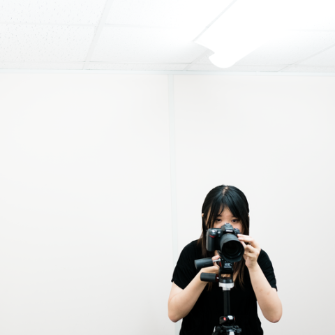 Student taking a photo with DSLR