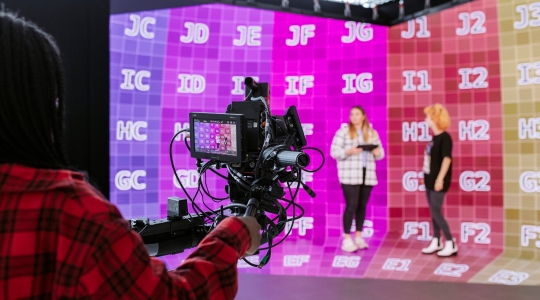 Three Students utilising the CCIXR Smart Stage Studio.