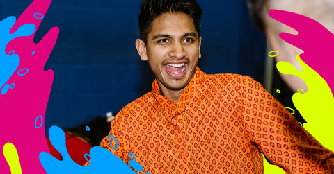 A cheerful student in an orange shirt