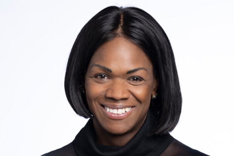 Headshot of Dame Vivian Hunt smiling to camera