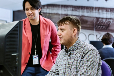 Student using financial software in university's Bloomberg Suite