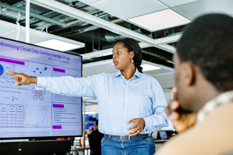 Information analyst looking at data on a monitor
