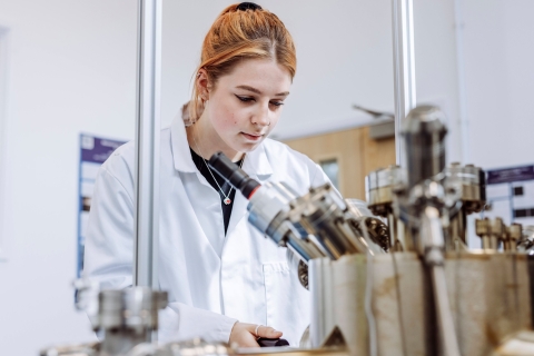Student conducting observation on device in Technology Facilities