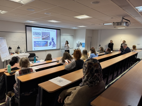 Students in a lecture theatre watching a presentation