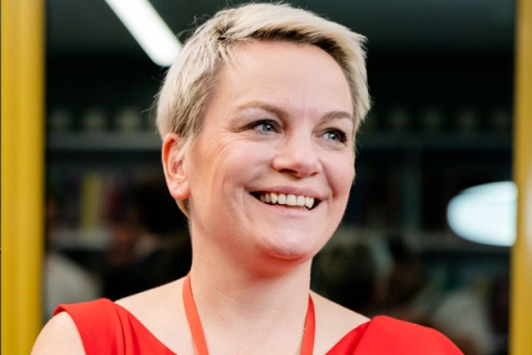 Jo de Serrano smiling and laughing in headshot image