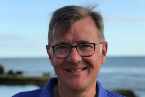 Michael Newey smiling to camera