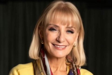 Headshot of Rosemary Reed looking to camera and smiling wearing smart clothes