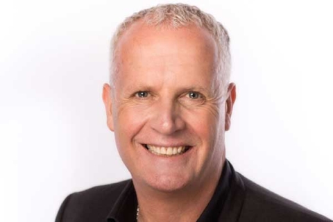 Headshot of Will King smiling to camera